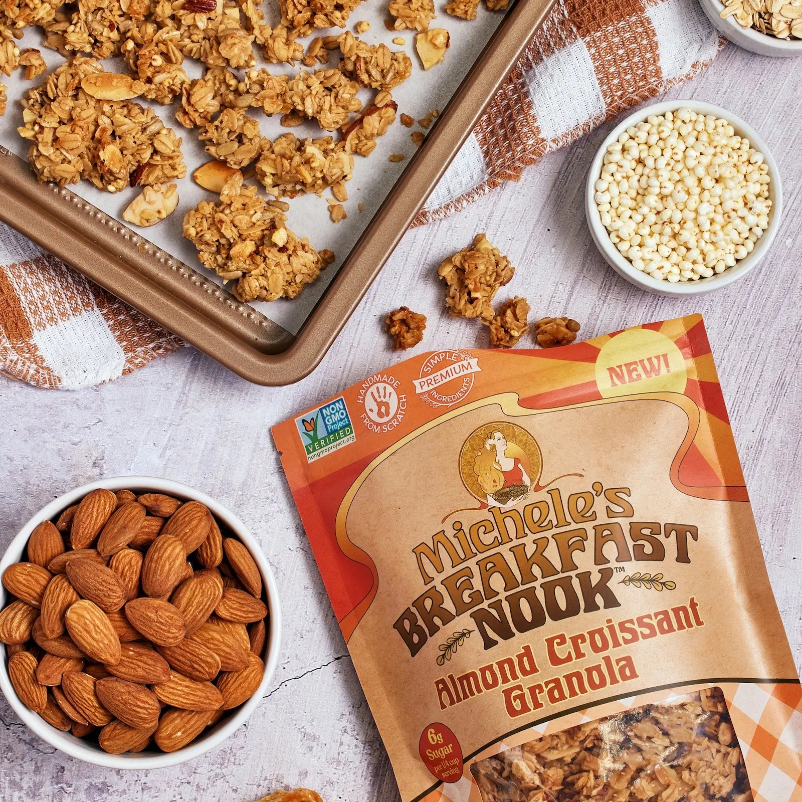 Michele's Breakfast Nook Almond Croissant Granola with ingredients on a table