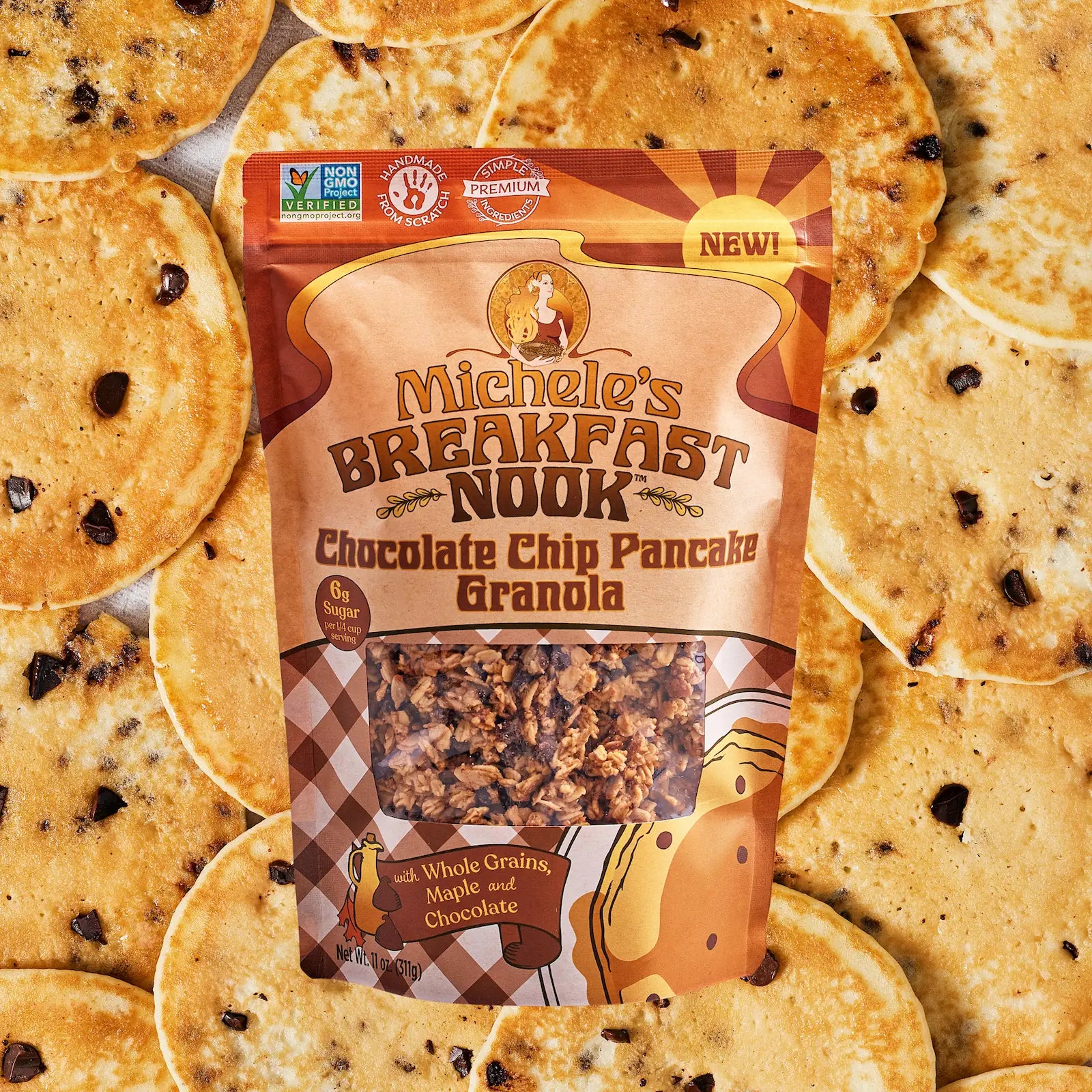 Michele's Breakfast Nook Chocolate Chip Pancake Granola package surrounded by pancakes