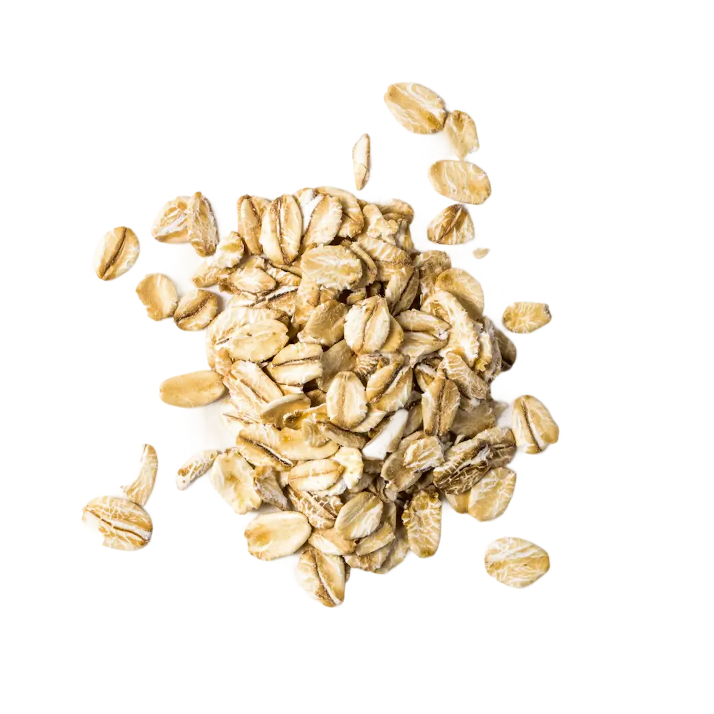 Pile of uncooked rolled oats on a white background