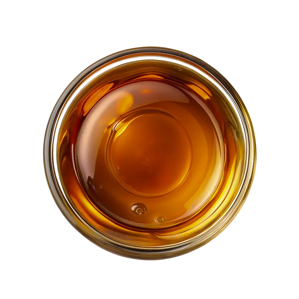Glass bowl filled with maple syrup